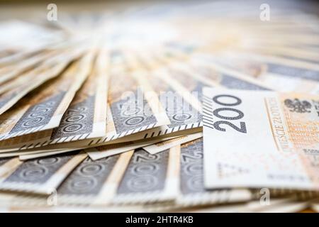 Concetto di politica monetaria polacca duecento banconote polacche Zloty PLN Mint Condition Foto Stock
