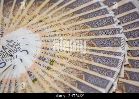 Concetto di politica monetaria polacca duecento banconote polacche Zloty PLN Mint Condition Foto Stock
