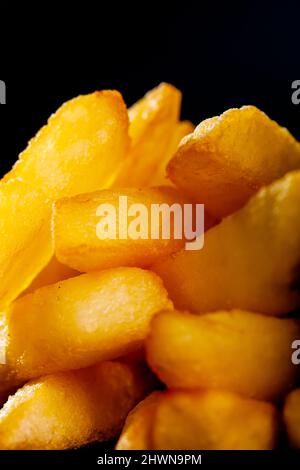 primo piano astratto patatine fritte fettine di patate. Foto Stock