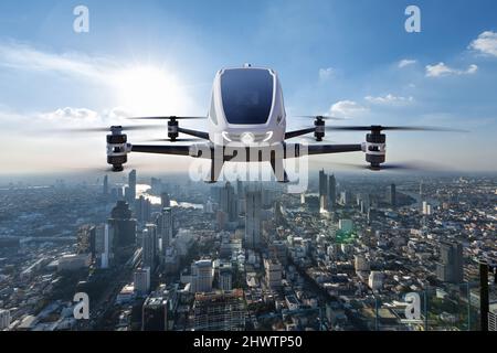 Veicolo aereo autonomo senza conducente che vola su sfondo urbano, trasporto futuro con 5G tecnologia concetto Foto Stock