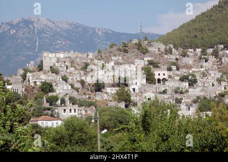 La Turchia, nei pressi di Fethiye, villaggio in rovina di Kaya Koy Foto Stock