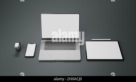 Dispositivi elettronici moderni mockup su sfondo grigio. Computer portatile, smartphone, touchpad tablet, smart watch e pennino bianco. 3d Foto Stock