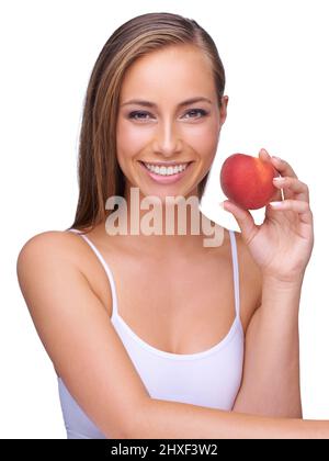 Fare scelte nutrizionali sane. Un uomo d'affari che guarda seriamente la macchina fotografica mentre tiene la sua mano in una posizione del campanile. Foto Stock