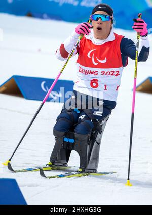 Zhangjiakou, Cina. 13th Mar 2022. Paralimpiadi, Para Nordic Sci, fondo, Freestyle, relè misto, Oksana Masters of the USA finisce come sciatore di partenza per il team statunitense nella gara a relè misto di 4 x 2,5 chilometri. Credit: Jens Büttner/dpa-Zentralbild/dpa/Alamy Live News Foto Stock