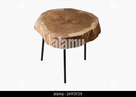 Shot of a three legged stool made of wood trunk and steel isolated on a white background Stock Photo