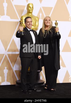 Lee Unkrich e Darla K. Anderson nella sala stampa dei premi Academy 90th Foto Stock