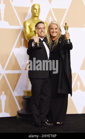 Lee Unkrich e Darla K. Anderson nella sala stampa dei premi Academy 90th Foto Stock