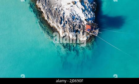 Beautiful high angle view of rocky cliffs on the water on Beach of Architiello of San Felice, Italy Stock Photo