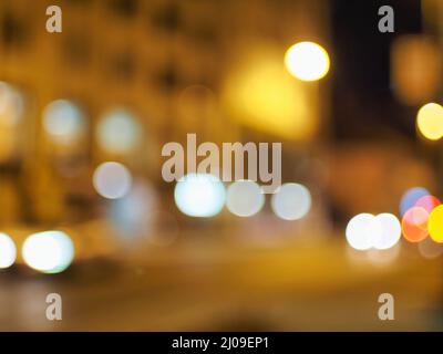 Bokeh filter background with brown lights against an out of focus street Foto Stock