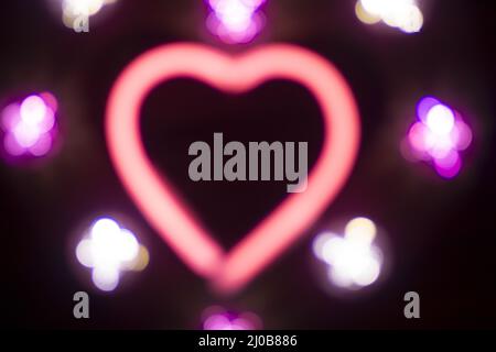 Neon amore cuore forma segno di notte Foto Stock