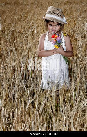 Ragazza in cornfield. Foto Stock