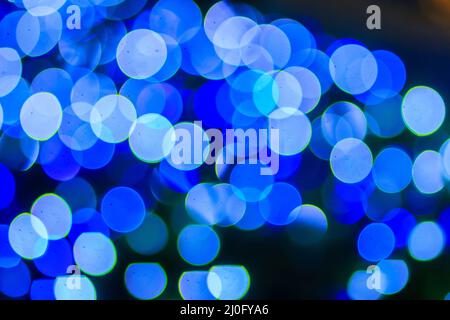 Bello sfondo blu bokeh astratto luce. Meraviglioso sfondo blu di natale defocused astratto. Luce di natale astratta Foto Stock