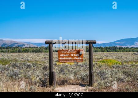 Una strada d'ingresso che porta a Grand Teton NP, Wyoming Foto Stock