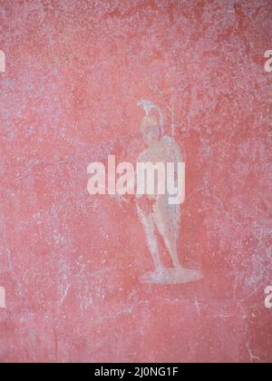 Dettaglio di un affresco raffigurante un guerriero su sfondo rosso presso la Casa di Ottavio Quartio, Pompei Foto Stock