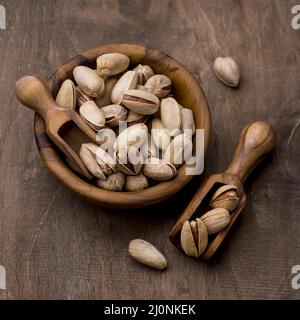 Ciotole di legno di pistacchio arrosto. Alta qualità e risoluzione bellissimo concetto di foto Foto Stock