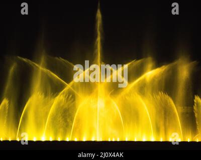 Beautiful fountain dancing show with reflection on water at night. Stock Photo