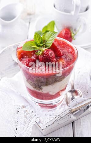 Traditional sweet strawberry dessert with yogurt served as close-up in a glass Stock Photo