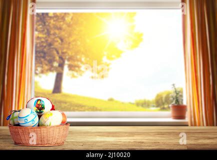 Easter background with colorful easter eggs on wooden background. Stock Photo