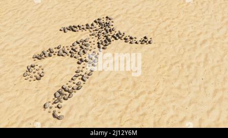 Concept pietre concettuali sulla spiaggia sabbia forma simbolo fatta a mano, sfondo di sabbia dorata, segno di un giocatore di calcio. 3d metafora di illustrazione per lo sport Foto Stock