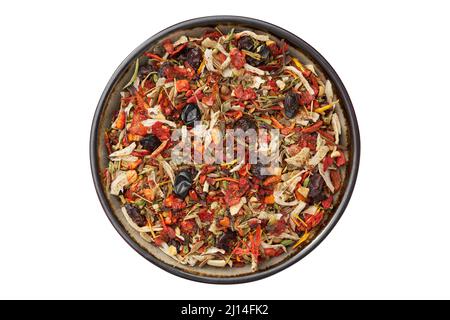 Ciotola di mix di spezie per la cottura di piatti orientali asiatici - plov, curry e altri. Fiocchi di prezzemolo, radici di sedano, pomodori, peperoncino rosso, paprika, onio Foto Stock