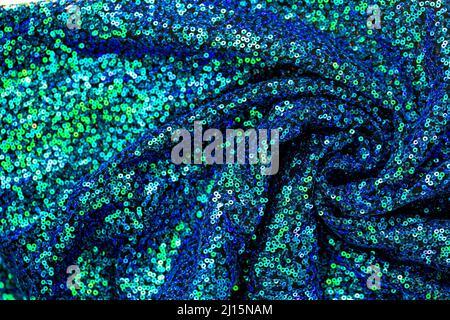 Texture sequins.Green blue sequins background.Shiny blue and green fabric.Handicraft and hobby. Tessitura e ricamo con paillettes. Foto Stock