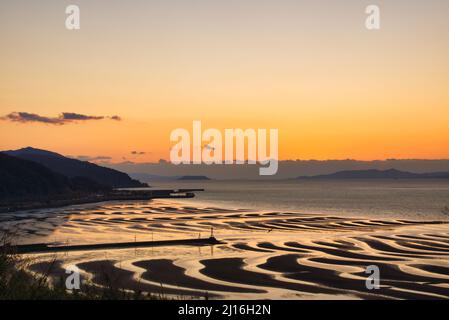 Okoshiki spiaggia di tramonto, Prefettura di Kumamoto, Giappone Foto Stock