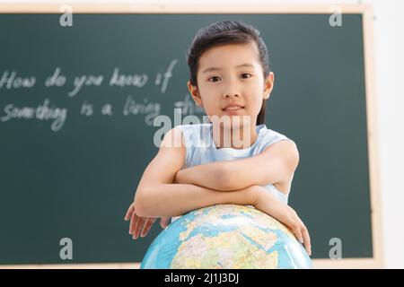 La scuola primaria le ragazze in classe Foto Stock