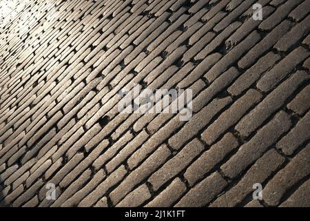 pietre di cobble in luce solare bassa Foto Stock