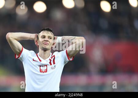 Chorzow, Polonia. 29th Mar 2022. Sebastian Szymanski di Polonia reagisce durante la partita di calcio di qualificazione della Coppa del mondo FIFA 2022 tra Polonia e Svezia a Chorzow, Polonia, 29 marzo 2022. Credit: Lukasz Sobala/Xinhua/Alamy Live News Foto Stock