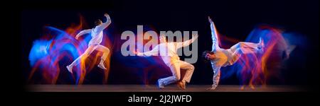 Immagine composita con elegante hip-hop danzante uomo, breakdance in abiti bianchi su sfondo scuro con luce al neon mista. Foto Stock