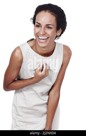 La shes ha ottenuto un sorriso vincente. Studio girato di una donna sicura che si posa su uno sfondo bianco. Foto Stock