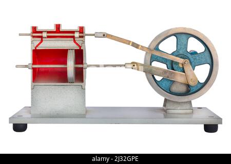 Modello didattico dell'interno di un motore per auto con pistone isolato su sfondo bianco Foto Stock