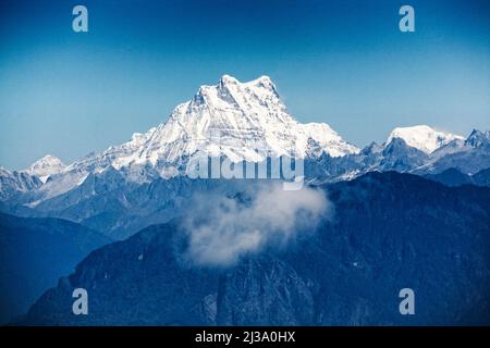 Il Masang Gang innevato sorge a oltre 7000 metri nell'Himalaya orientale, nel paese del Bhutan. Foto Stock