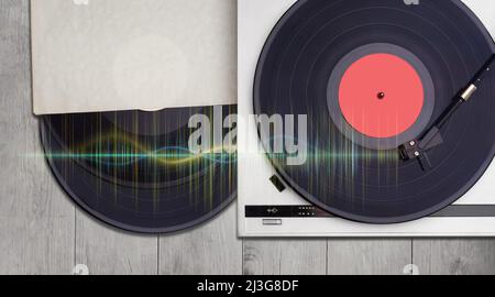 lettore di dischi vinilici e dischi vinilici su sfondo di legno. Musica retrò e audio per audiofili Foto Stock