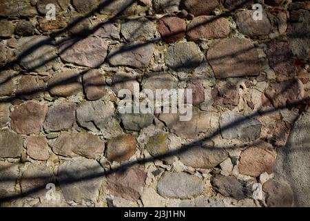 Muro, muro di pietra di campo, fusione ombra Foto Stock