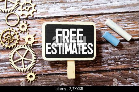 Stima gratuita - Scrittura a mano femminile su lavagna. Foto Stock