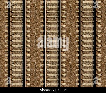 Motivo ferroviario senza cuciture, sfondo con spazio per il testo. Vista dall'alto. Guide in ferro lucido e traversine in cemento, accoppiate con potenti bulloni su terreno sassoso Foto Stock