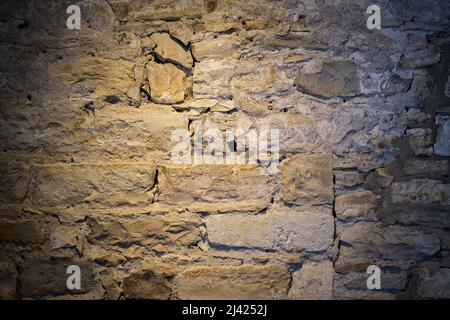Vecchio sfondo in pietra con luce sfumata su di esso. Foto Stock