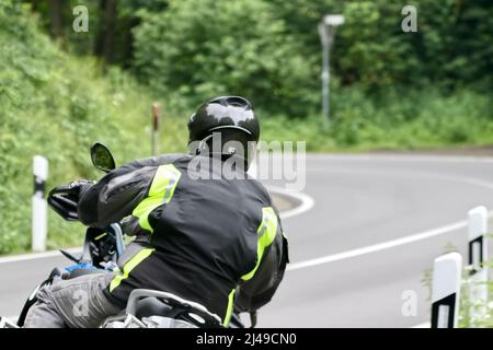 motociclista in curva Foto Stock