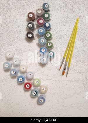 una pittura per un'immagine di colori diversi con pennelli su tela Foto Stock