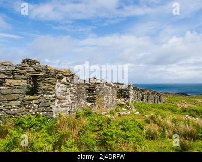 Le rovine di Riasg Buidhe e abbandonato villaggio di pescatori sull'isola interna Ebridea di Colonsay Foto Stock