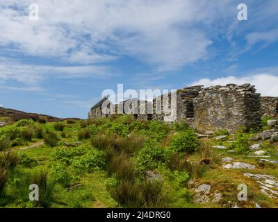 Le rovine di Riasg Buidhe e abbandonato villaggio di pescatori sull'isola interna Ebridea di Colonsay Foto Stock