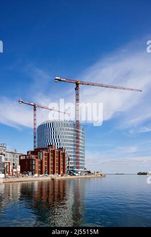 Costruzione dell'edificio circolare degli uffici 'Spidsen' a Nordø/Redmolen, Copenaghen, Danimarca Foto Stock