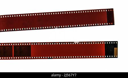 Primo piano di due pellicole fotografiche vintage negative cracked e colorate Foto Stock