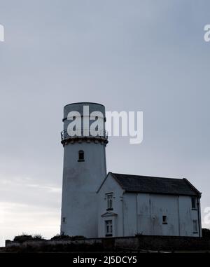 L'iconico faro di Old Hunstanton al tramonto. Foto Stock