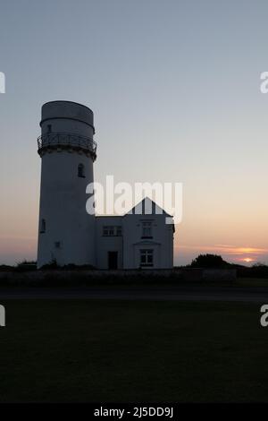 L'iconico faro di Old Hunstanton al tramonto. Foto Stock