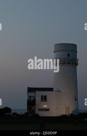 L'iconico faro di Old Hunstanton al tramonto. Foto Stock