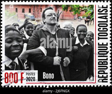 Bono con bambini africani in francobollo Foto Stock