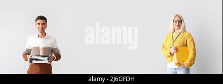 Giovane uomo e donna matura che tengono documenti su sfondo chiaro con spazio per il testo Foto Stock