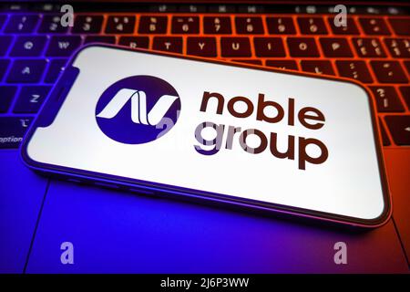 In questa figura, sullo schermo di uno smartphone viene visualizzato il logo Noble Group. (Foto di Sheldon Cooper / SOPA Images/Sipa USA) Foto Stock